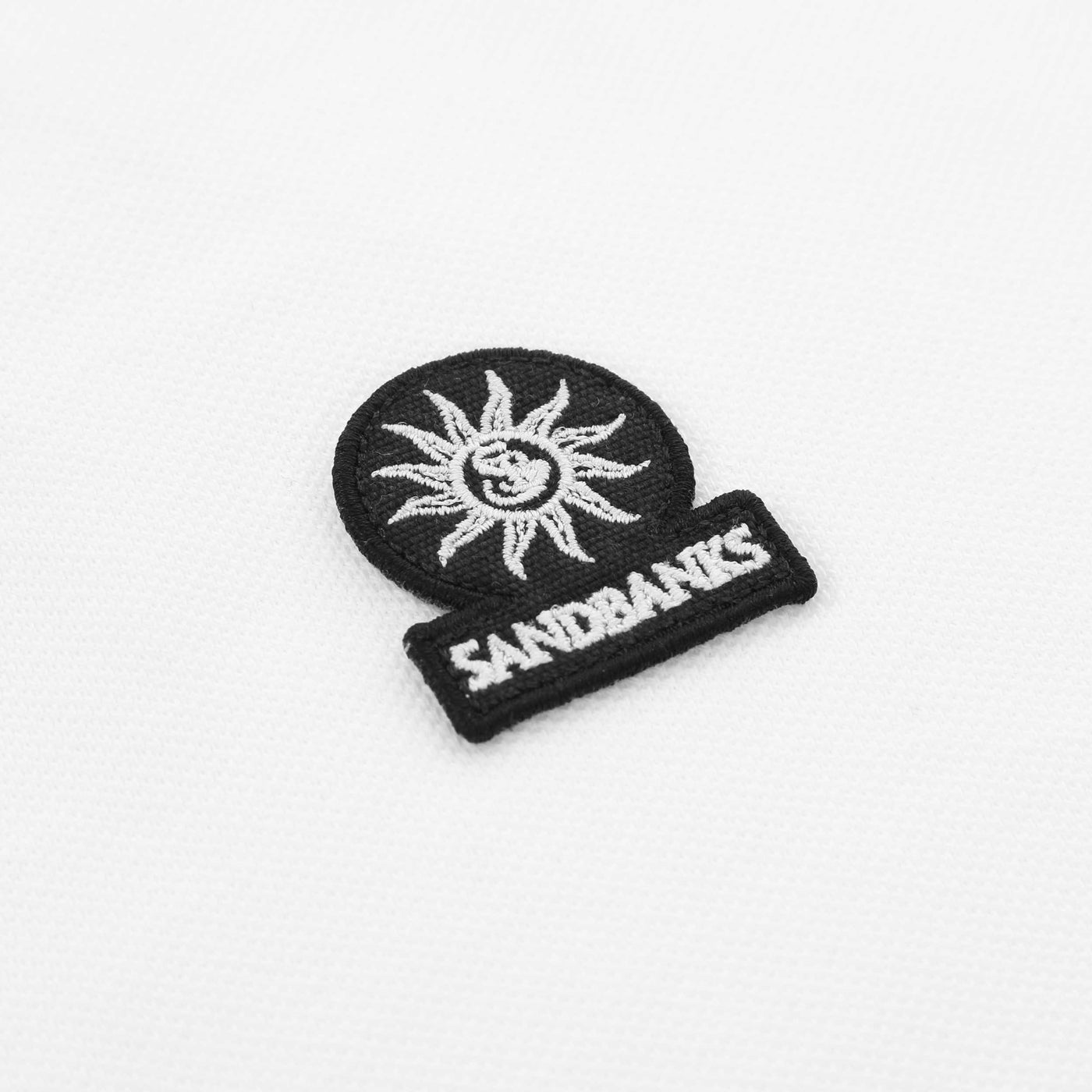 Sandbanks Badge Logo Polo Shirt in White Logo